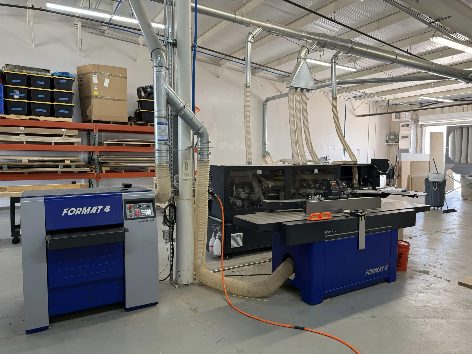 The Format-4 sliding saw and jointer on the shop floor, ducted to dust collection