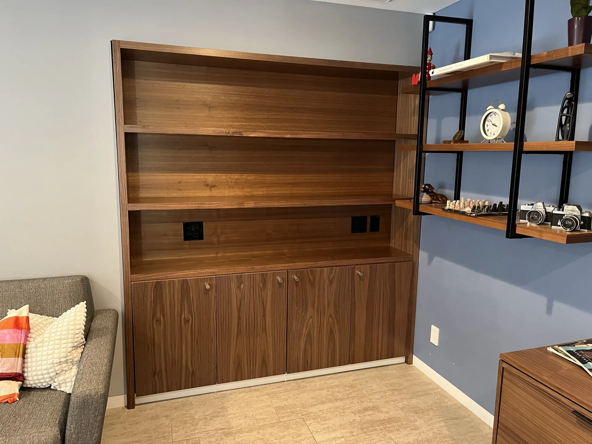 A walnut bookcase and cabinet built-in in a home office