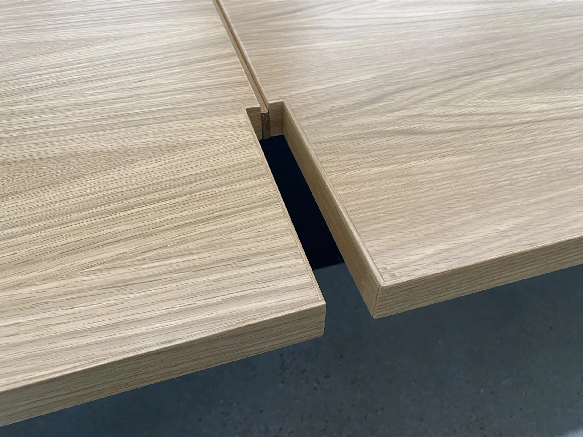 Close detail of a mitered panel corner, showing the edge banding and the tight outside corner